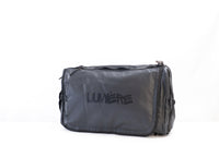 Lumière SHIFT 4-in-1 travel bag in black, front view with tonal logo