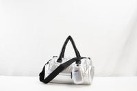 Lumière Statement crossbody in silver with the crossbody strap attached