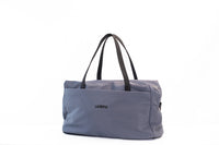 Lumière Utility travel duffel in grey, front view